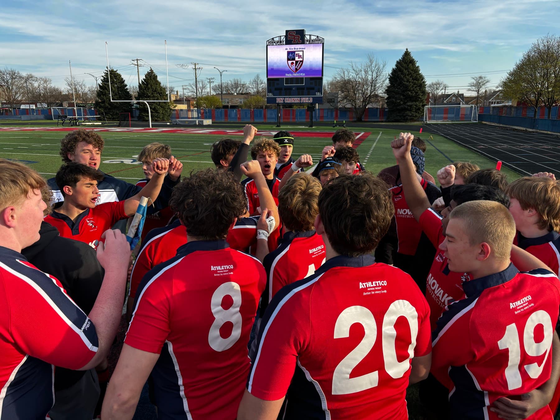 Fortivus players gathered around their coaches after a match