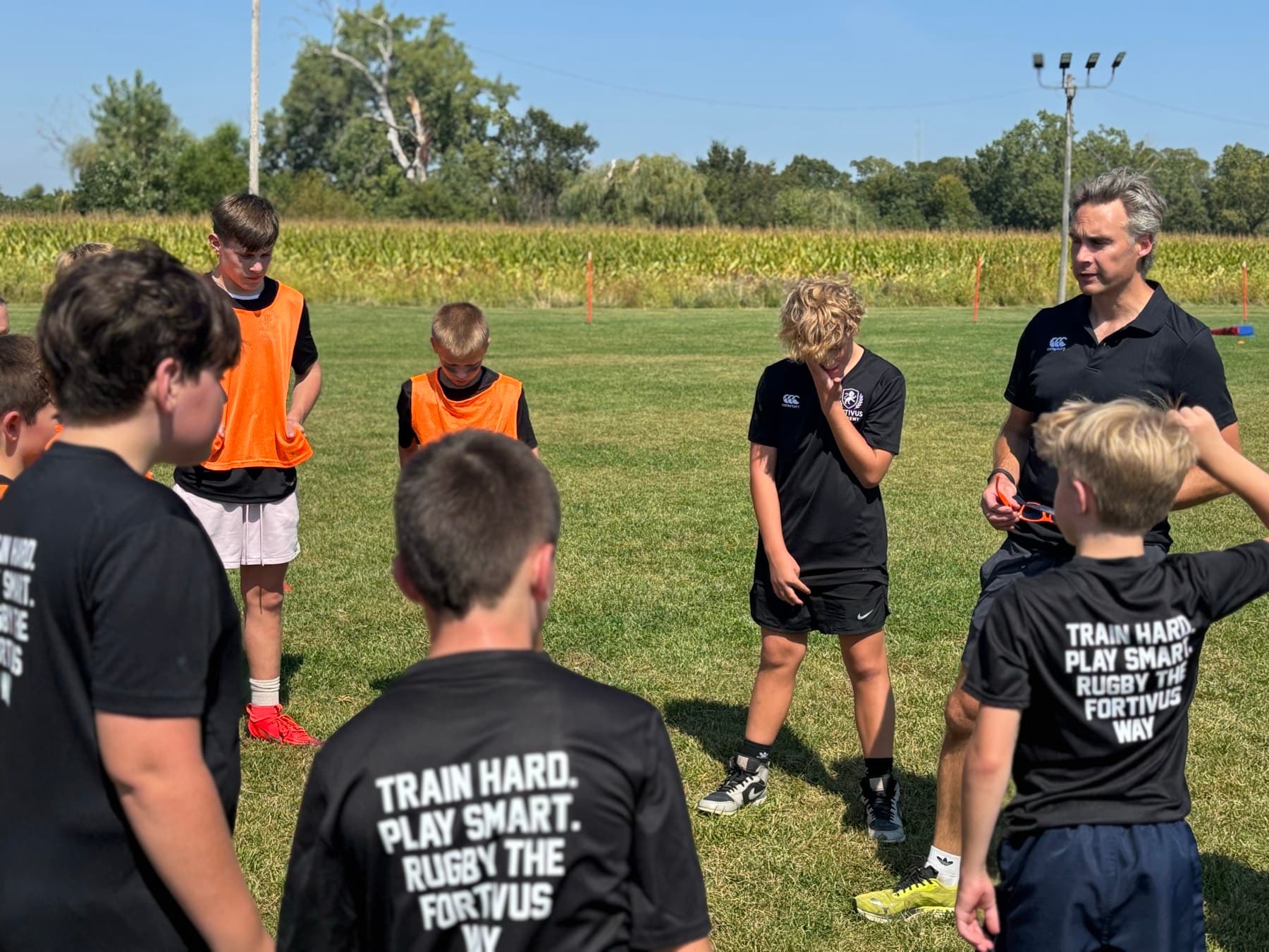 Young Fortivus players learning rugby on the field